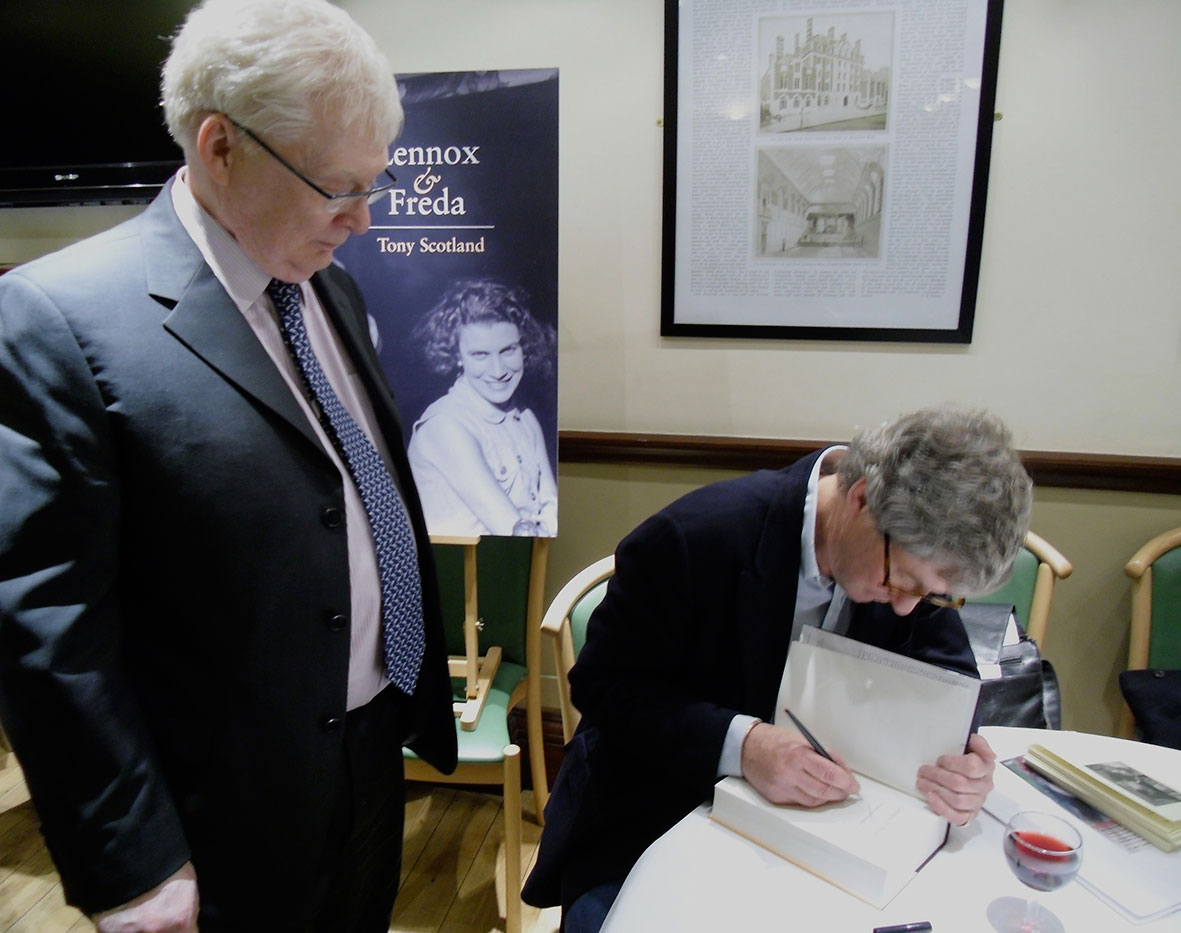 Tony Scotland signing a copy of his book for the pianist Graham Johnson